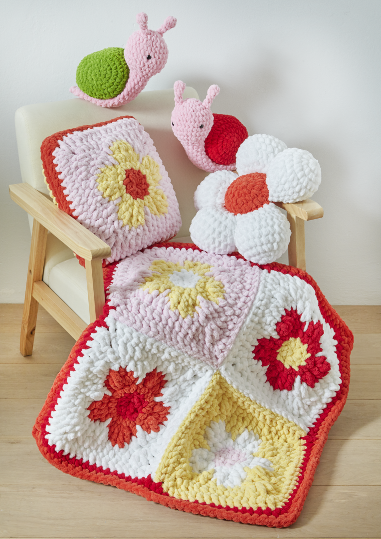 King Cole Jumbo Toastie Flower Cushions, Blanket and Snail Toy Crochet Pattern 6389